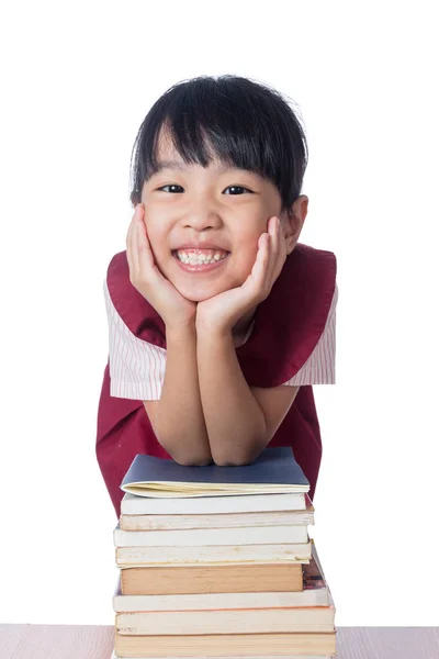 Aziatische Chinese meisje met stapels boeken — Stockfoto