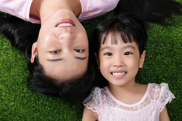 Asian Chinese mother and daughter looking at camera and smiling — Stock Photo, Image