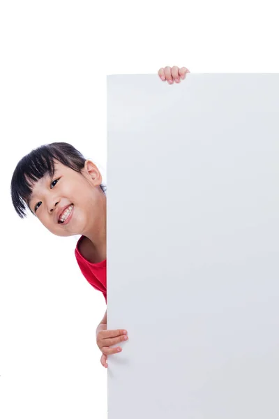 Asian Chinese little girl behind a blank white board — Stock Photo, Image