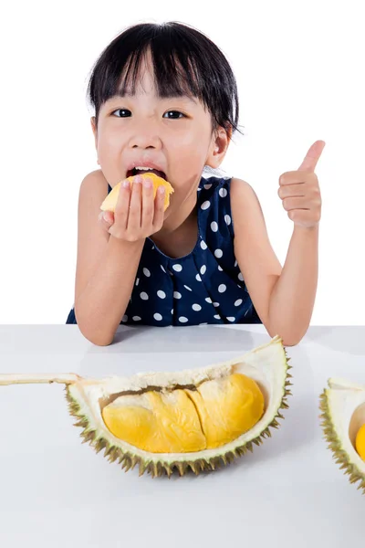 Asian Chinese little girl eating durian fruit — Stock Photo, Image