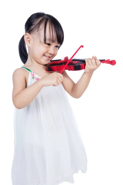 Азиатская маленькая девочка играет на скрипке — стоковое фото