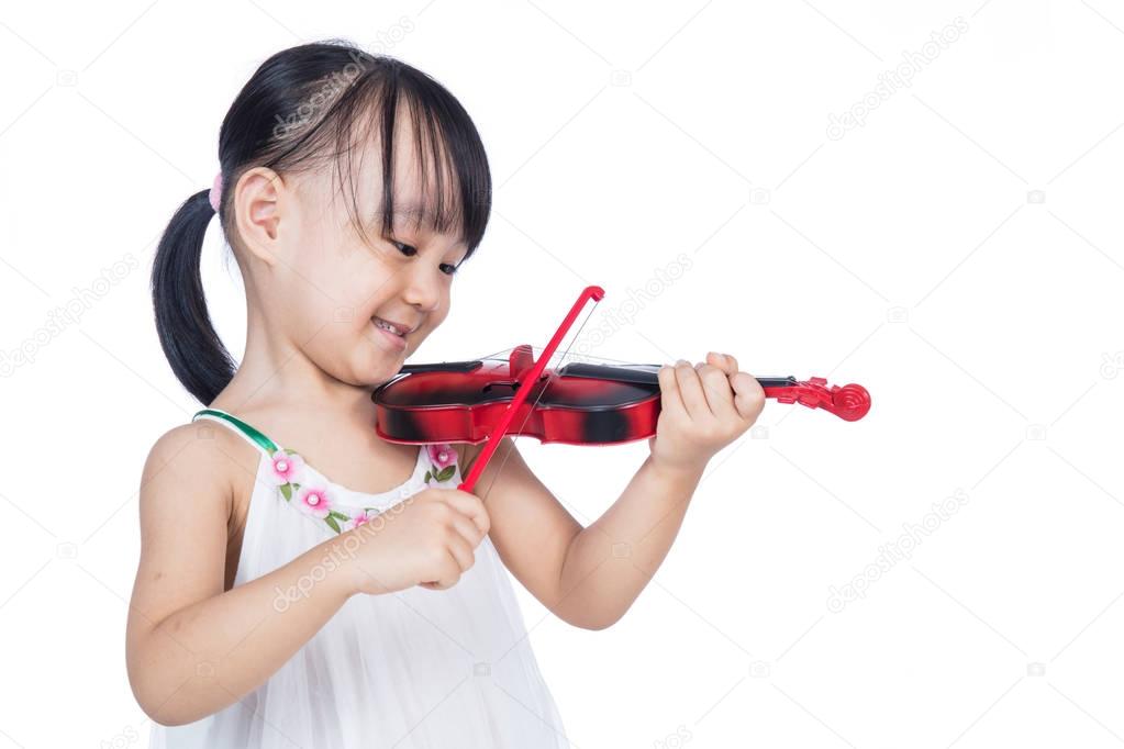 Asian chinese little girl playing violin