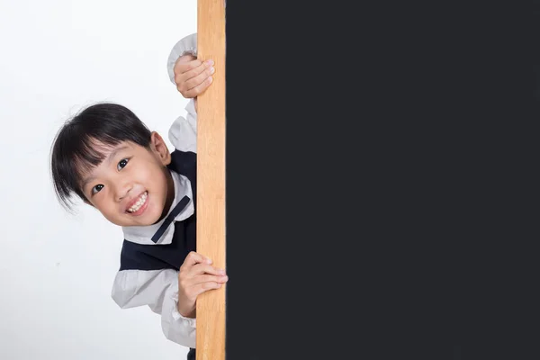 Asian Chinese little girl behind the blackboard — Stock Photo, Image