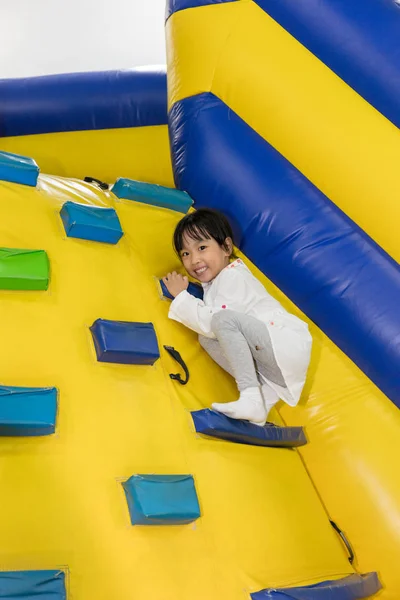 Asian Little Chinese Girl climbing up ramp — Stock Photo, Image
