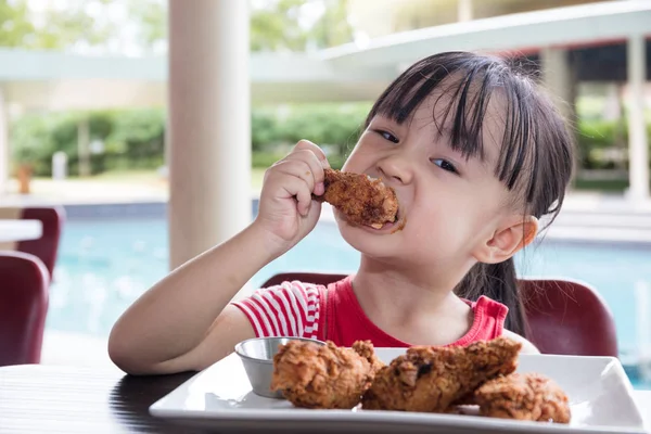 Asian Little Chinese Girl Eating Fried chicken — Stock Photo, Image