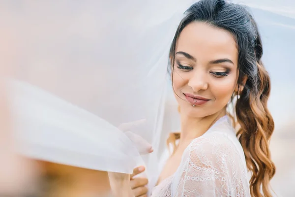 Bride in her underwear and a dressing gown — Stock Photo, Image