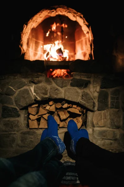 Guy Girl Sitting Wooden House Background Burning Fireplace — Stock Photo, Image