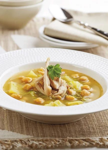 Chicken soup with potatoes and chickpeas — Stock Photo, Image