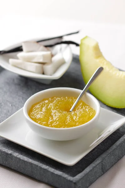 Homemade melon jam with coconut and vanilla in a bowl