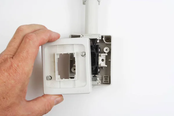 Installing a waterproof electrical switch for exterior use. — Stock Photo, Image