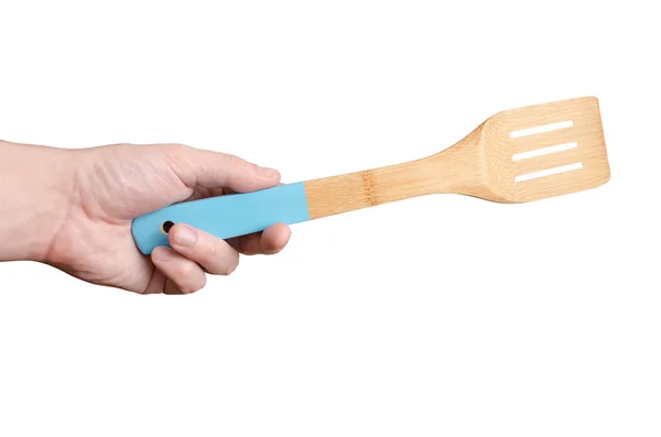 Beyaz bir arka plan üzerinde izole bir spatula tutan adam el