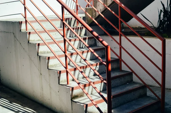 Abstract emergency stairs access for people, gray textured color empty stairway indoors grungy structure background