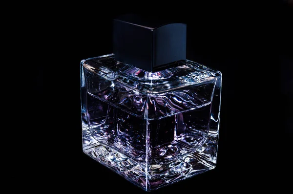 Glass bottle on black. — Stock Photo, Image