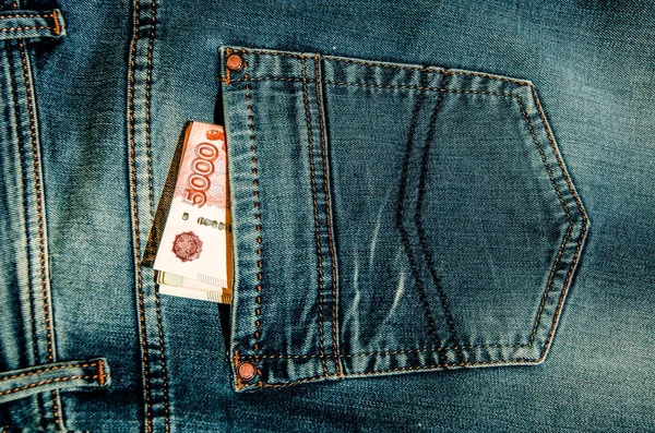 Jeans and money. — Stock Photo, Image