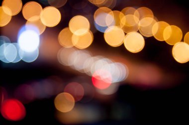 Noel 'in soyut, bulanık, dairesel, sarı, kırmızı arka planı