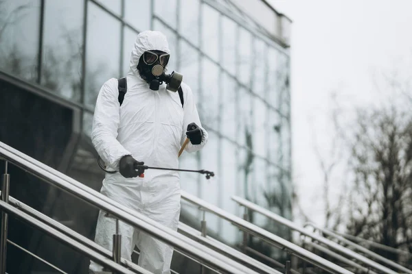 Cleaning and Disinfection at town complex amid the coronavirus epidemic Professional teams for disinfection efforts Infection prevention and control of epidemic Protective suit and mask.