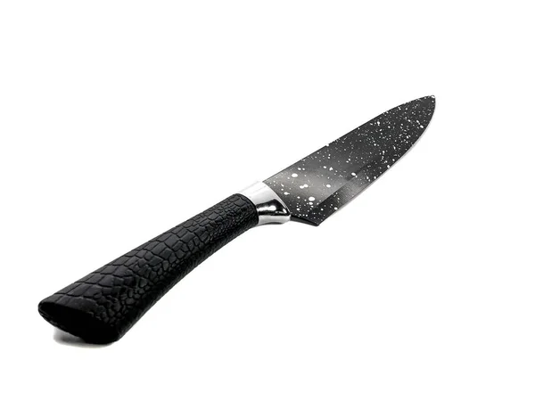 Utility knife isolated on a white background. Black sharp knife with white dots. Paring knife. Carving knife