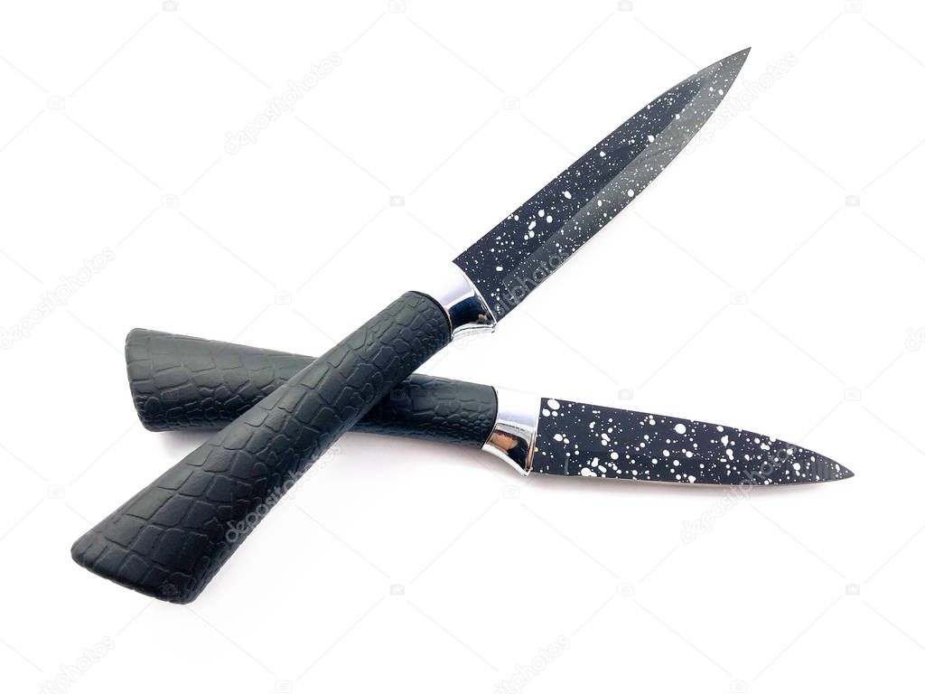 Multipurpose knives isolated on a white background. Composition of black sharp knives with white dots. Set of knives for peeling vegetables. Chopping knives. 