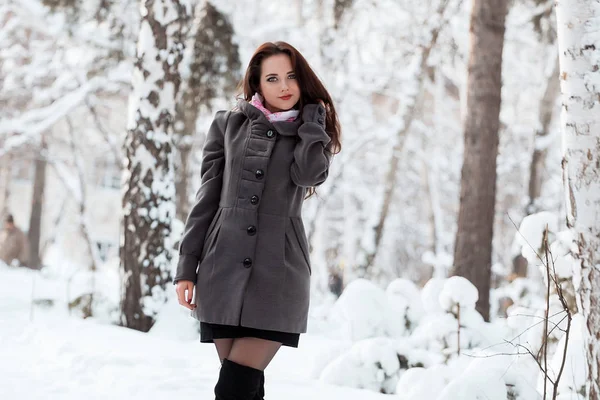 Beautiful young girl in winter forest — Stock Photo, Image