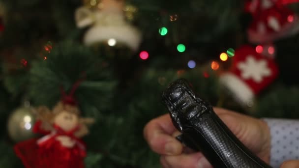 Man opening champagne bottle during christmas time — Stock Video