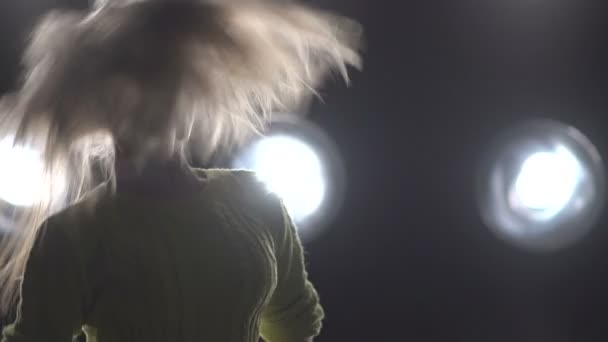 Silhouette of a girl dancing on the background lights. — Stock Video