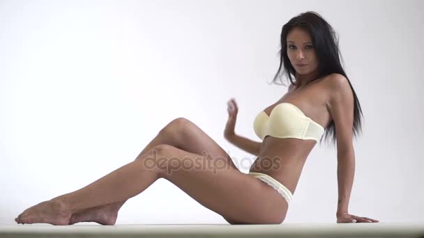 Girl in lingerie on white background — Stock Video