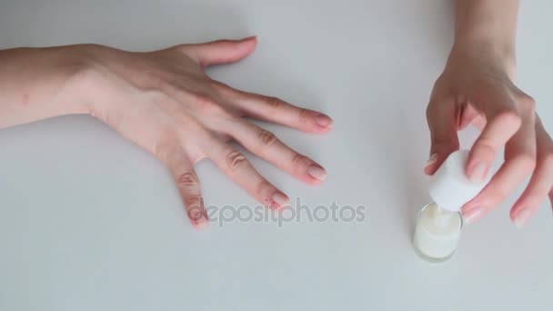 Woman painting her nails — Stok video