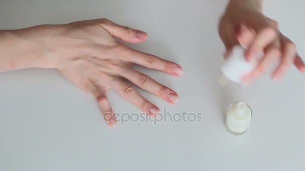 Woman painting her nails — Stockvideo