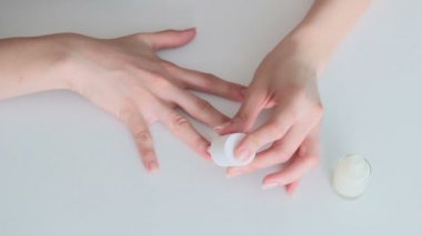 Woman painting her nails