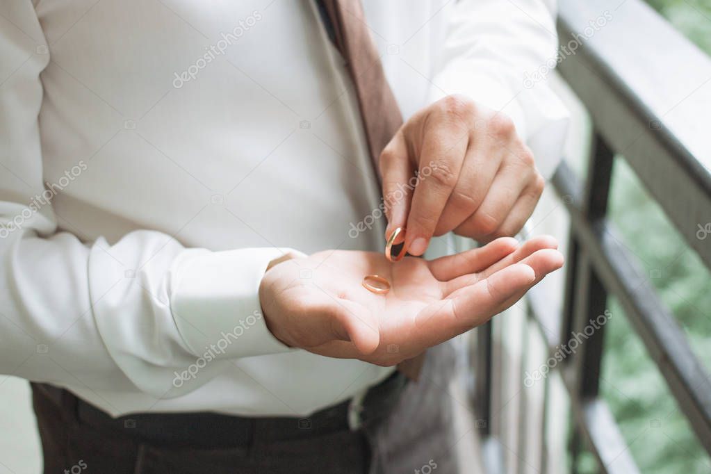 Man is taking off the wedding ring