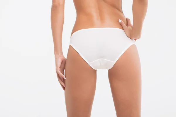 Cuerpo perfecto mujer joven sobre un fondo blanco en lencería sexy —  Fotos de Stock