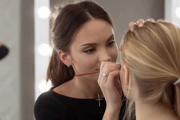 Make-up artist work in her studio