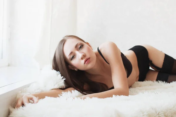 The girl in dark lingerie — Stock Photo, Image