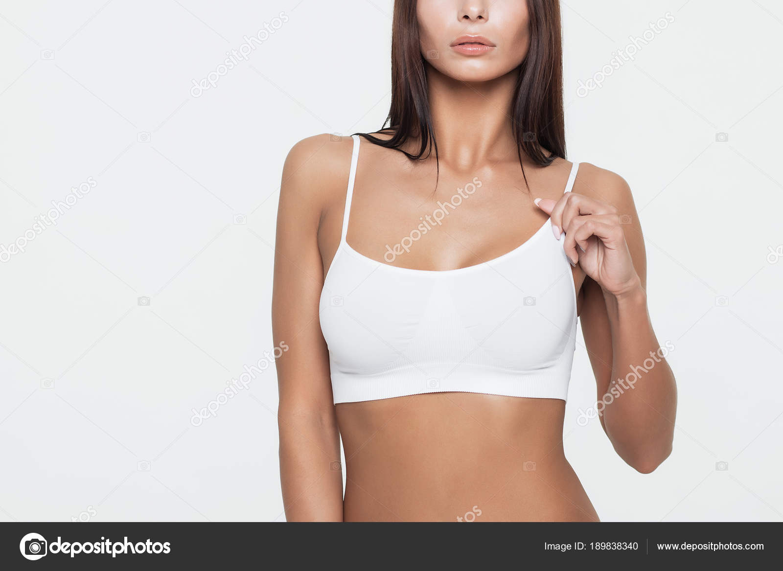 Young beautiful girl shows her gorgeous Breasts Stock Photo by