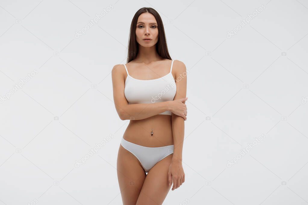 Sensual woman in underwear looking at camera alluringly