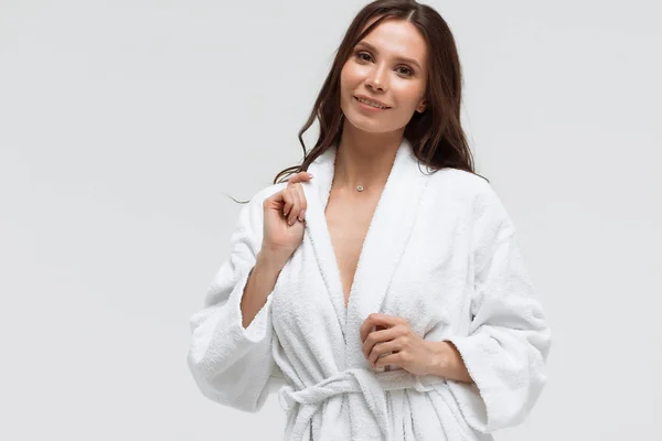 Charming tender woman in soft white bathrobe — Stock Photo, Image