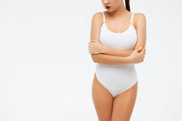 Crop gorgeous woman taking off swimsuit — Stock Photo, Image