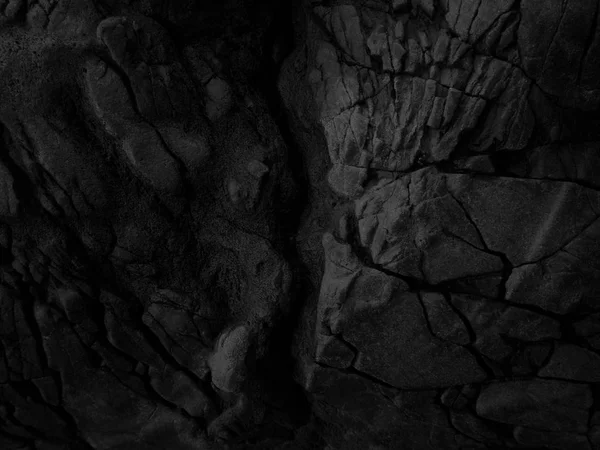 Zwarte close-up rotsen. Donkere steen. — Stockfoto