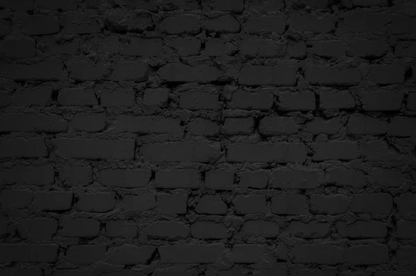 Zwarte achtergrond van stenen muur — Stockfoto
