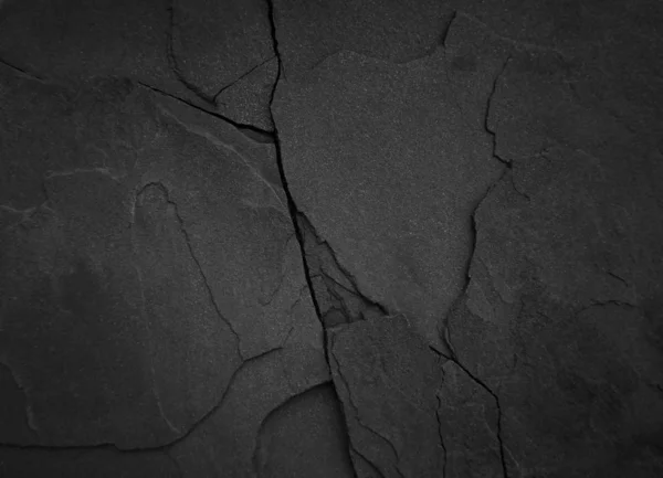 Темный крупный план песка на скалах — стоковое фото