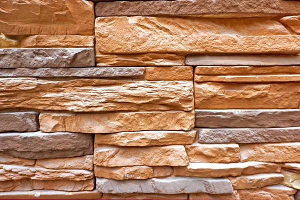 Revestimiento de pared de piedra hecho de rocas apiladas blancas — Foto de Stock