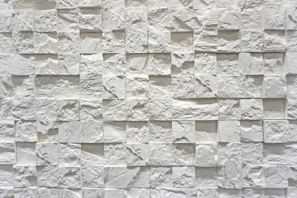 White cladding wall made of stoneware with interlocking tiles