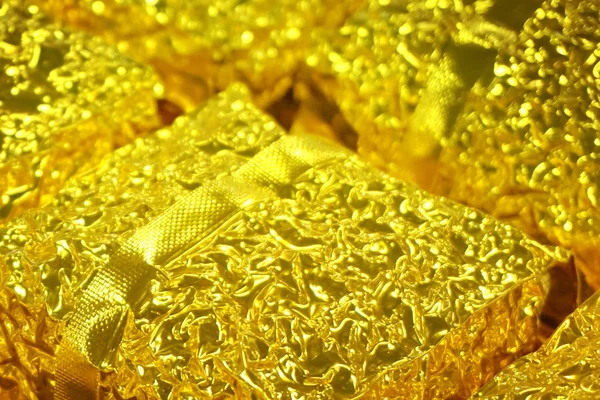 Shiny packaging in gold color — 스톡 사진