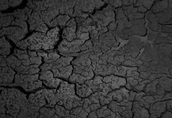 Ένα ξηρό ραγισμένο υπόβαθρο της γης — Φωτογραφία Αρχείου
