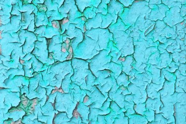 Duvardaki kırık mavi boyanın yakın plan ayrıntıları..                               
