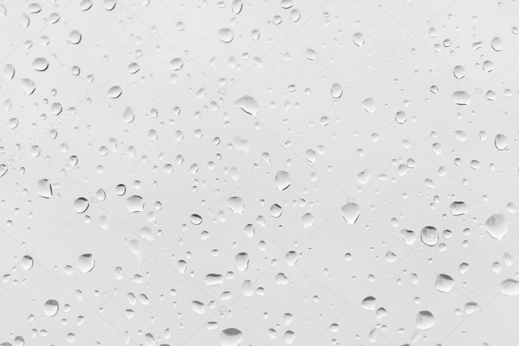 Raindrops water drop on window glass, white beautyful background.                              