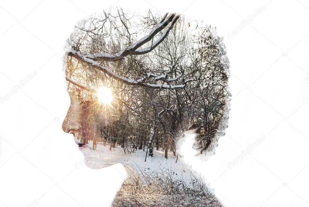 Double exposure portrait of young woman and forest , snow
