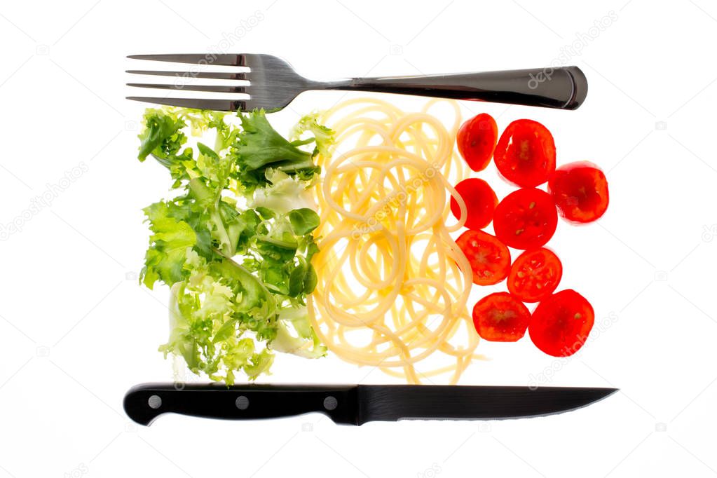 Italian restaurant, food with flag colors. Pasta, lettuce and to