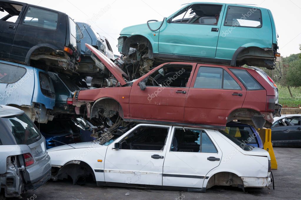 Cars in junkyard,  pile for recycling. 