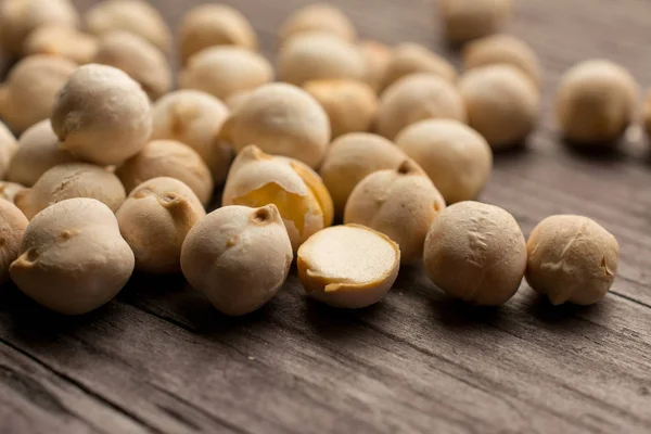 stock image Roasted chickpeas on wooden table